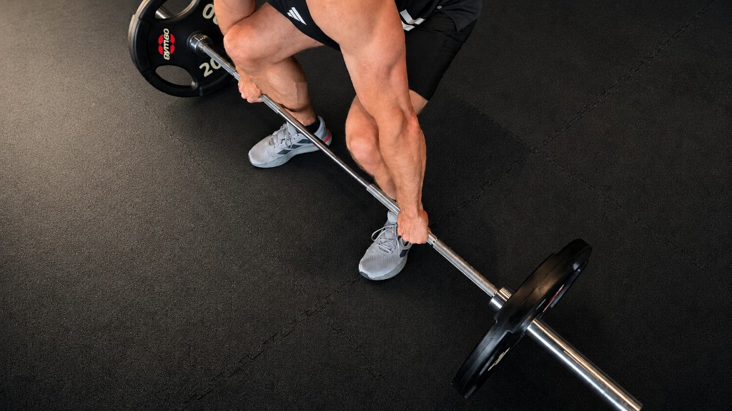 Athlete preparing to lift a barbell in the gym